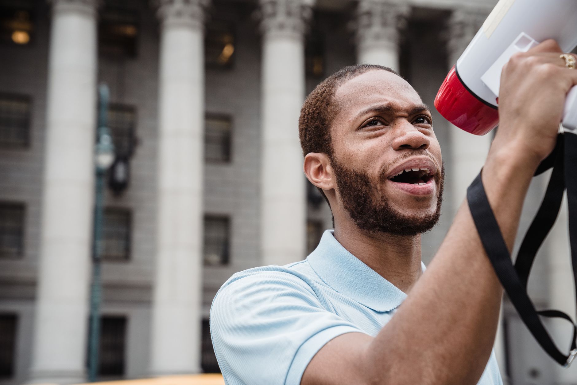 A celebrity speaking at a social justice rally, inspiring attendees. — celebrity activism
