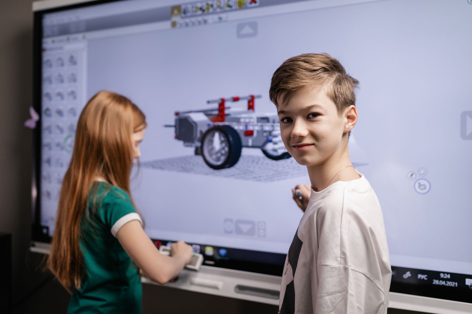 A classroom equipped with modern technology including tablets and smartboards, showcasing the integration of tech in learn…