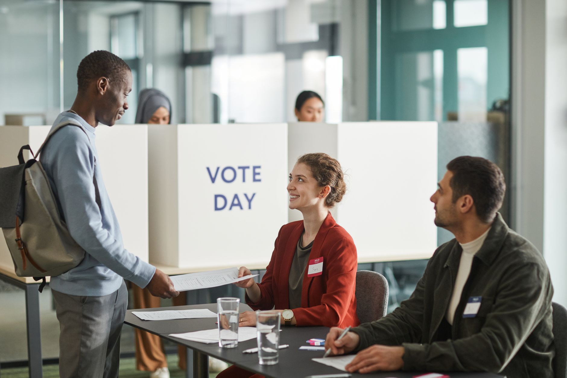 A classroom setting where students are discussing civic engagement and the voting process in the context of the voting age debate.