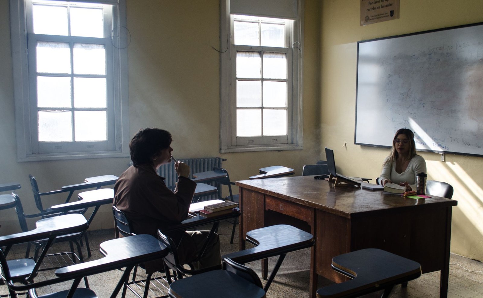A classroom setting where students are practicing debate skills, highlighting the importance of education in fostering dem…