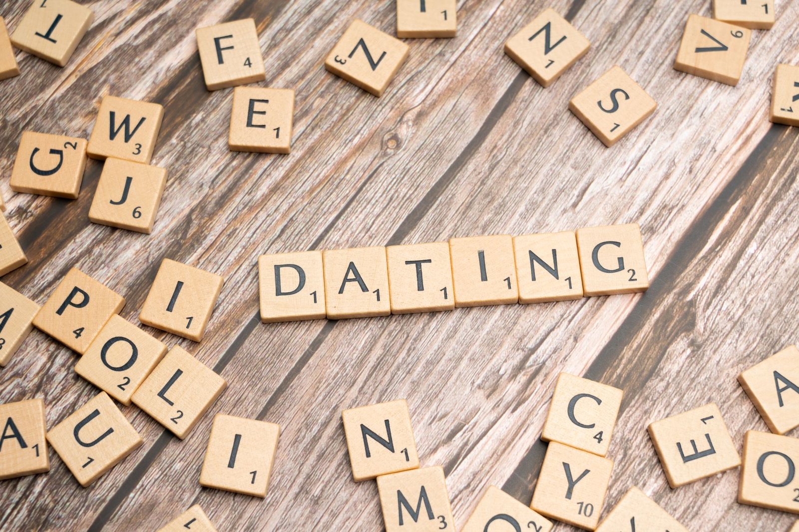 A collage of various dating apps on smartphones, illustrating the modern approach to dating debate.