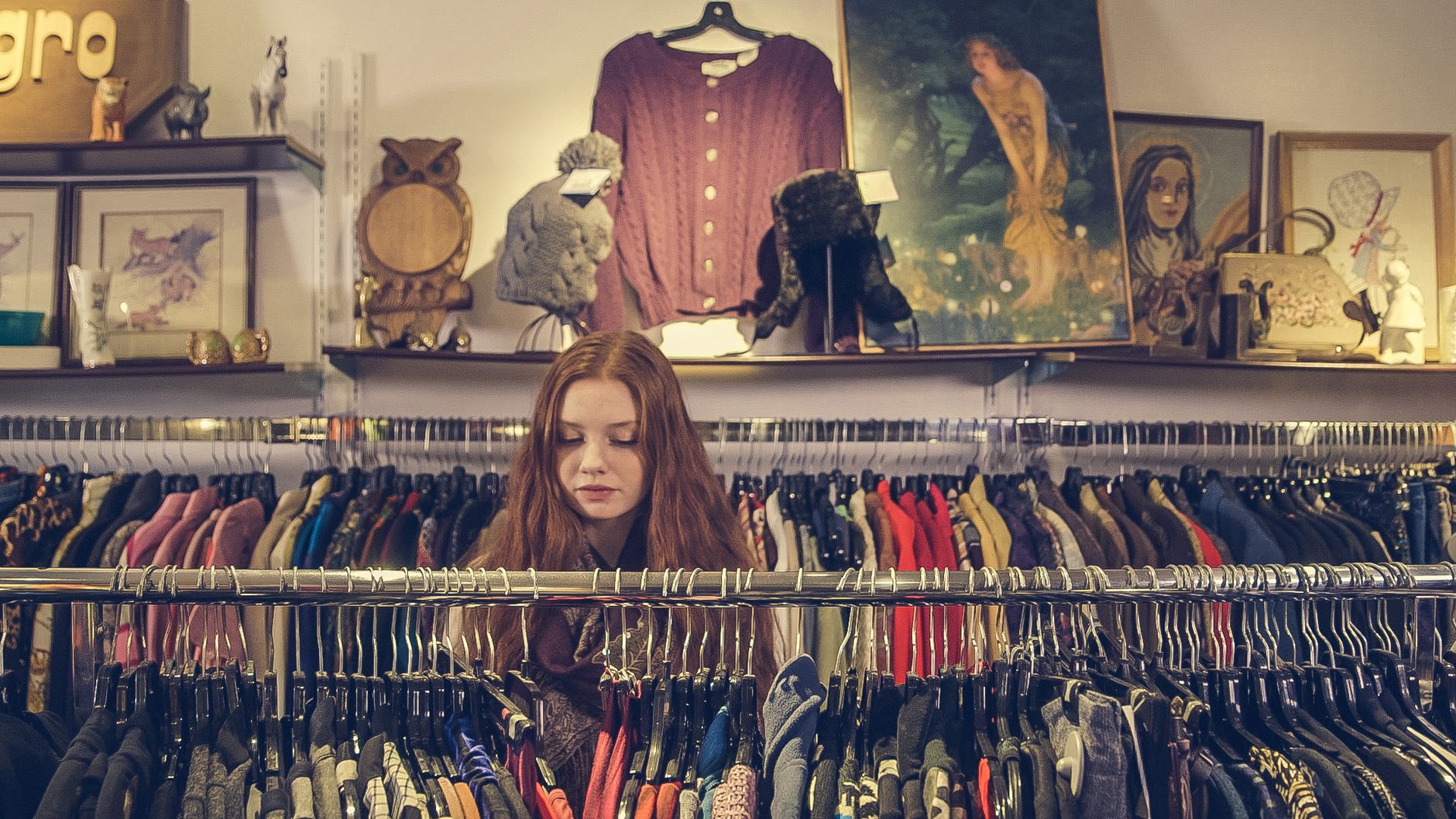A comparison of sustainable vs. fast fashion clothing items on a store rack — fast fashion debate