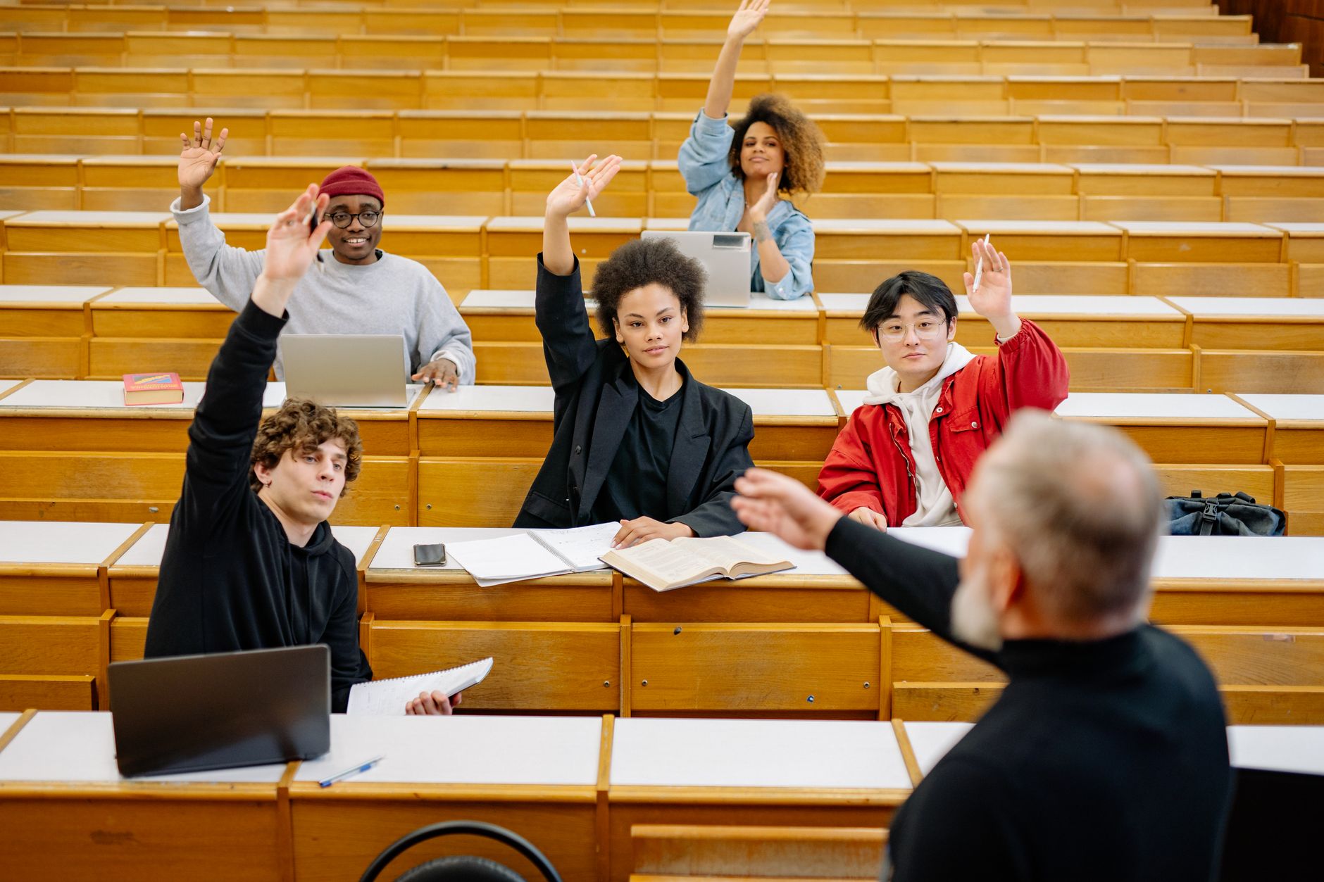 A diverse group of students actively participating in a debate session. — debate club guide