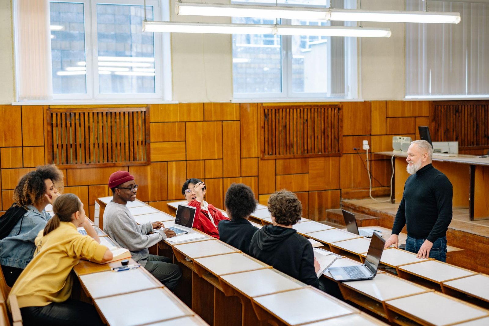 A group of diverse individuals engaged in a lively debate, representing the essence of democratic discourse. — debate an…