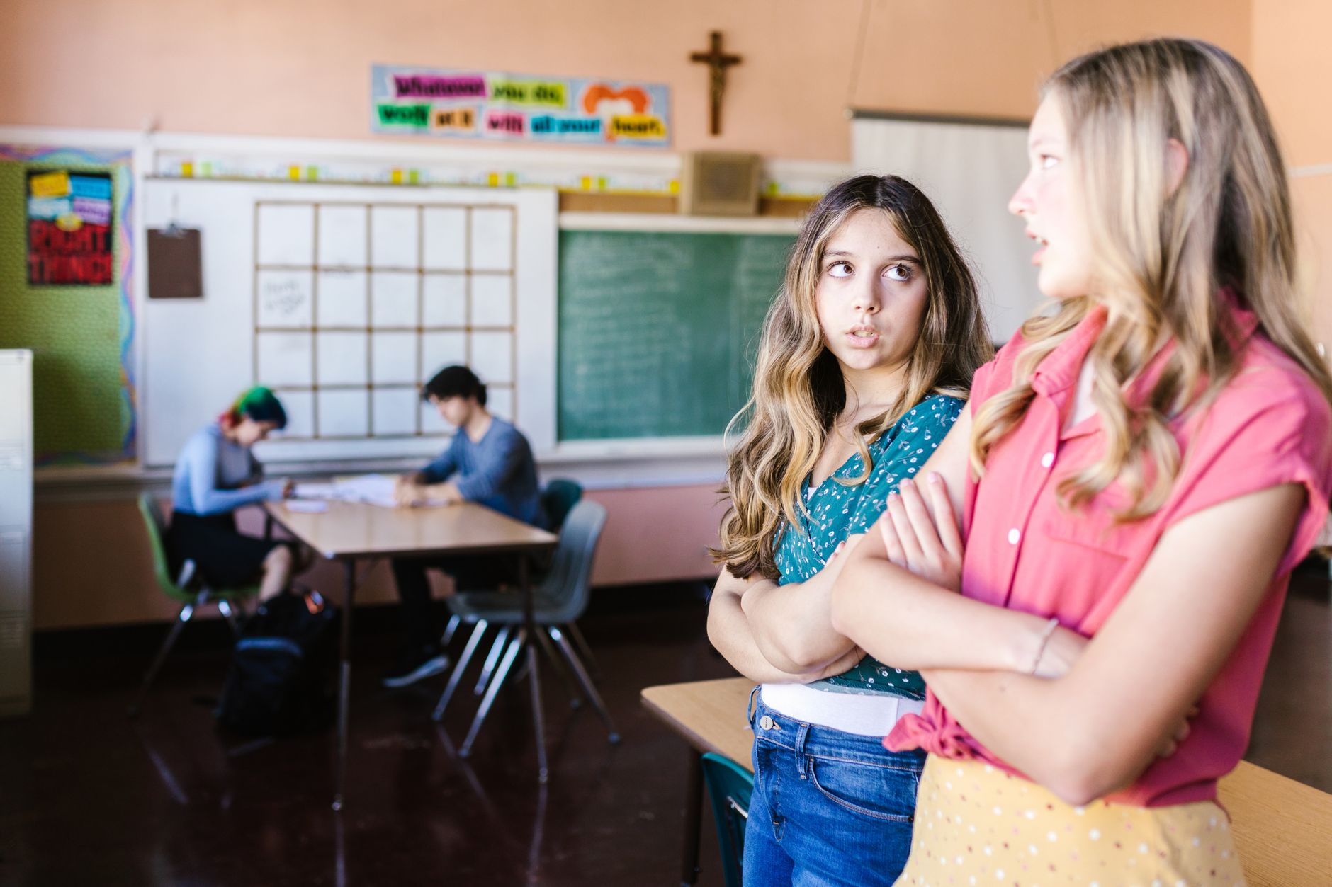 A group of high school students engaging in a lively debate in a classroom setting, showcasing teamwork and communication.…