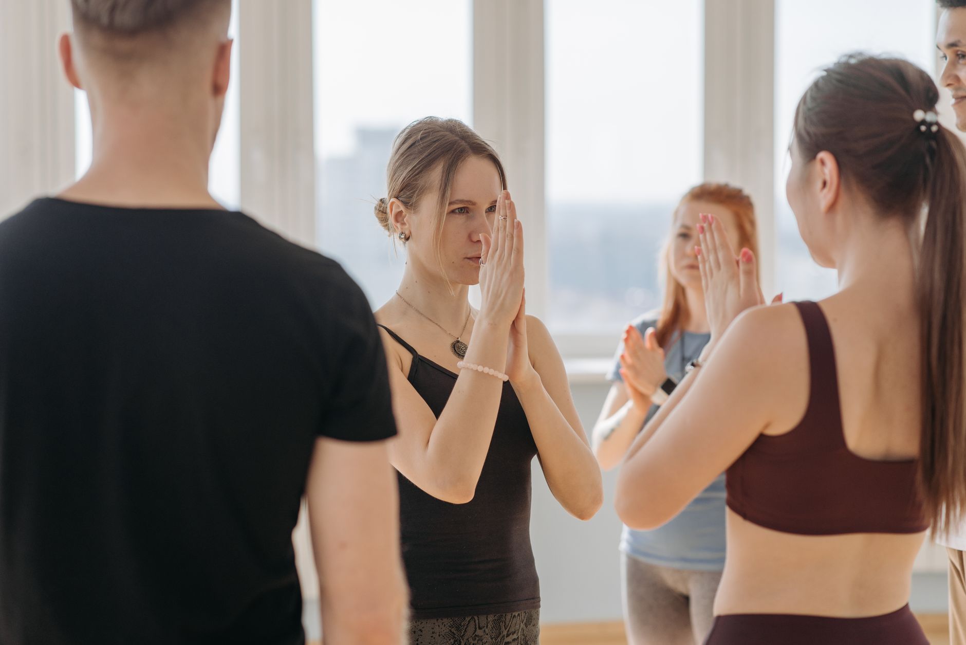 A group of individuals engaging in a role-playing exercise focused on handling counterarguments
