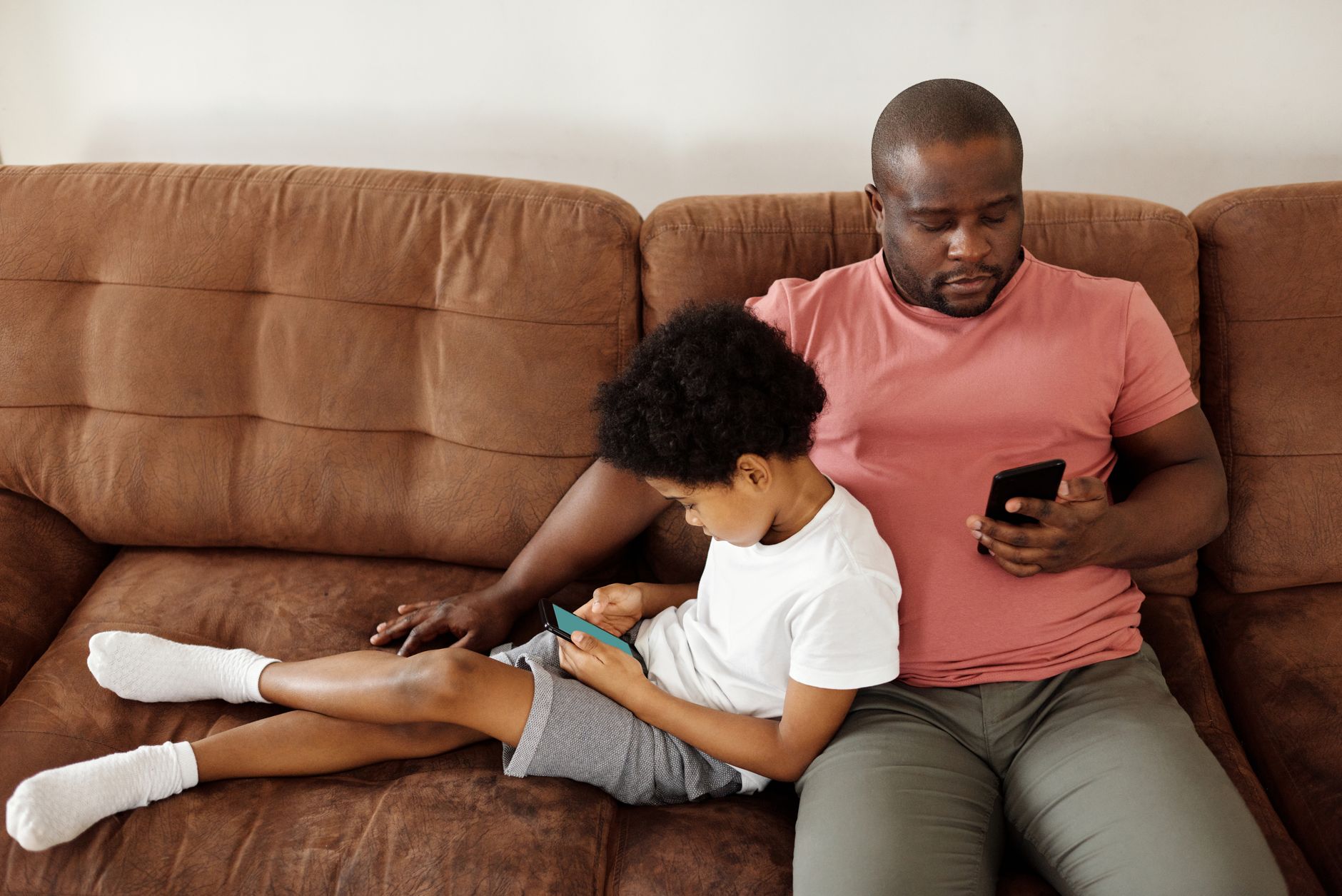 A parent and child discussing smartphone usage together, emphasizing open communication. — parental control debate