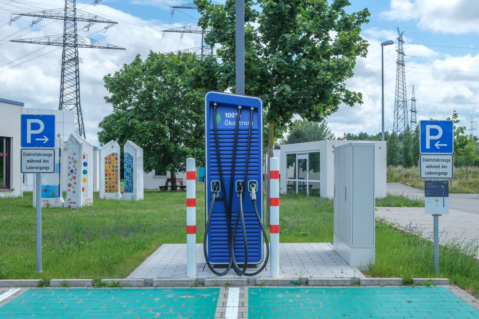 A photo of a charging station with electric cars to illustrate infrastructure. — electric cars debate
