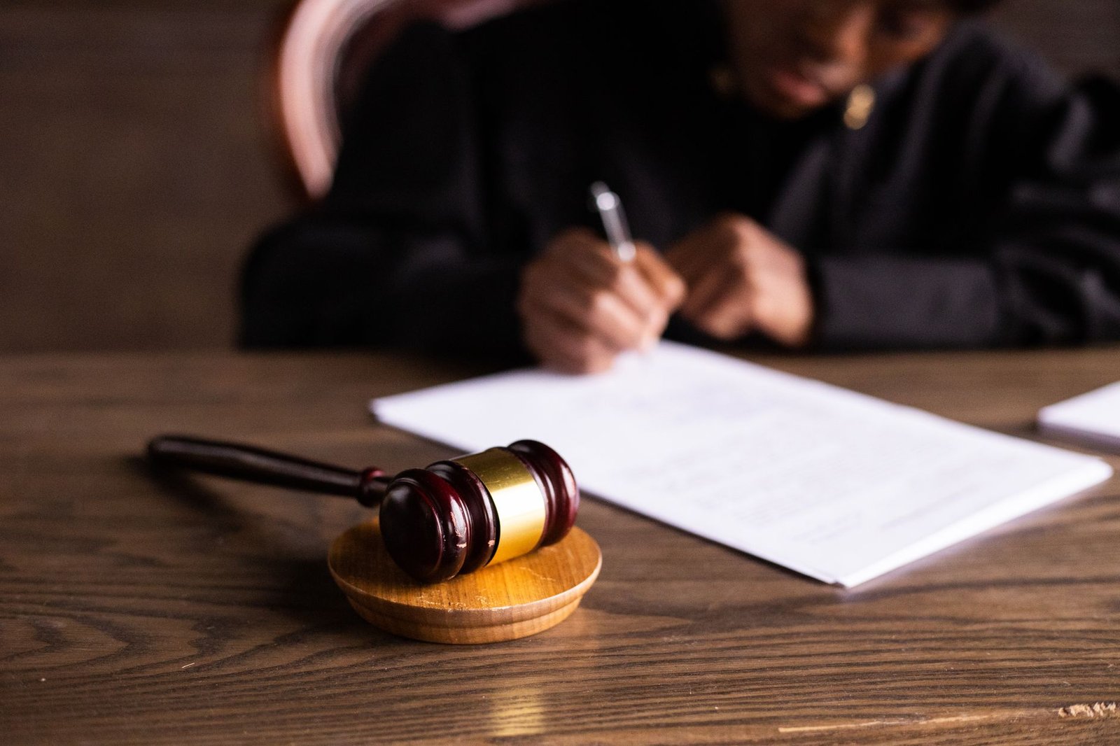 A photo of a debate judge taking notes during a competition, showcasing the judging process in action. — debate judging