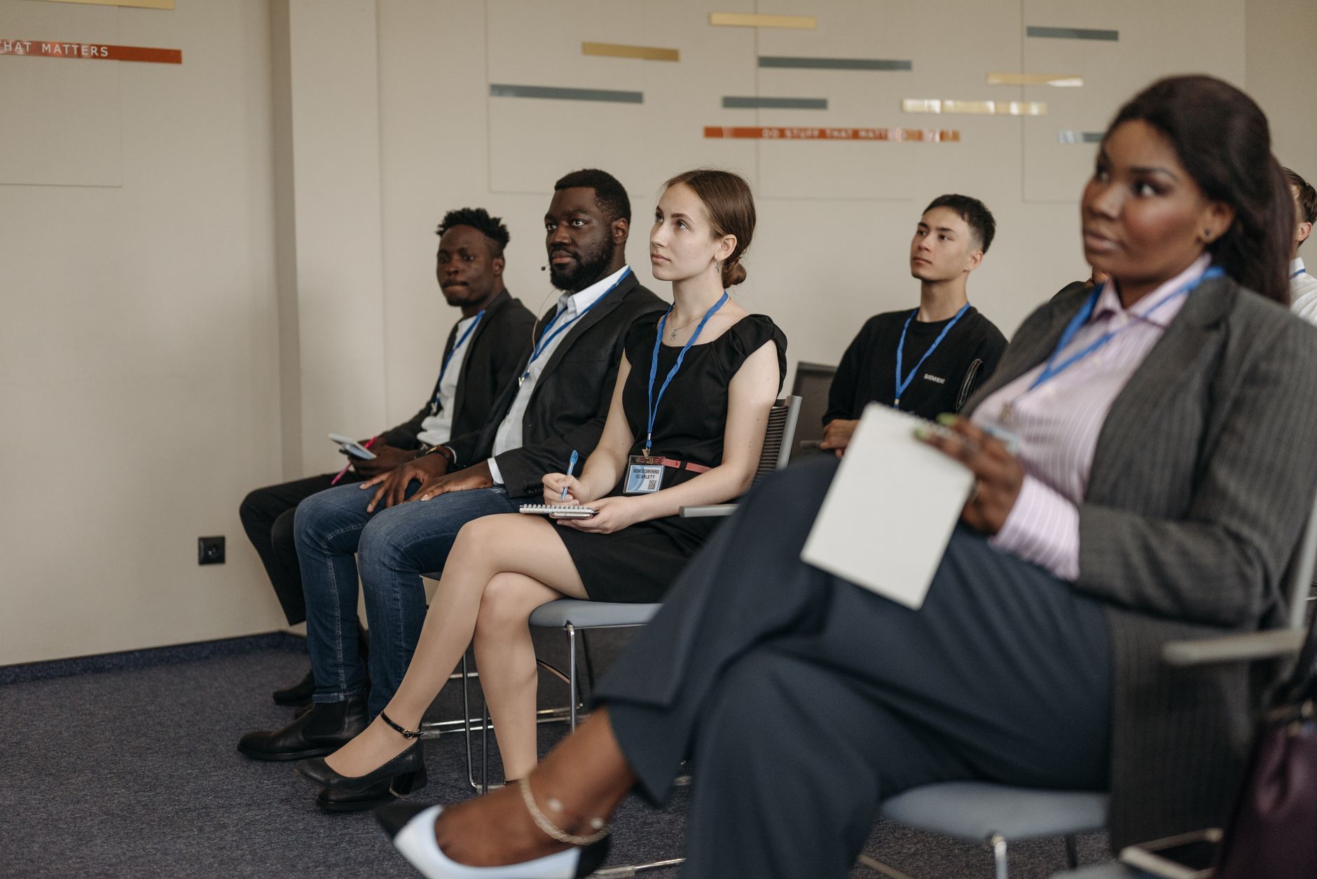 A photo of a diverse debate team engaged in a discussion, showcasing active listening and empathy in action. — debater p…