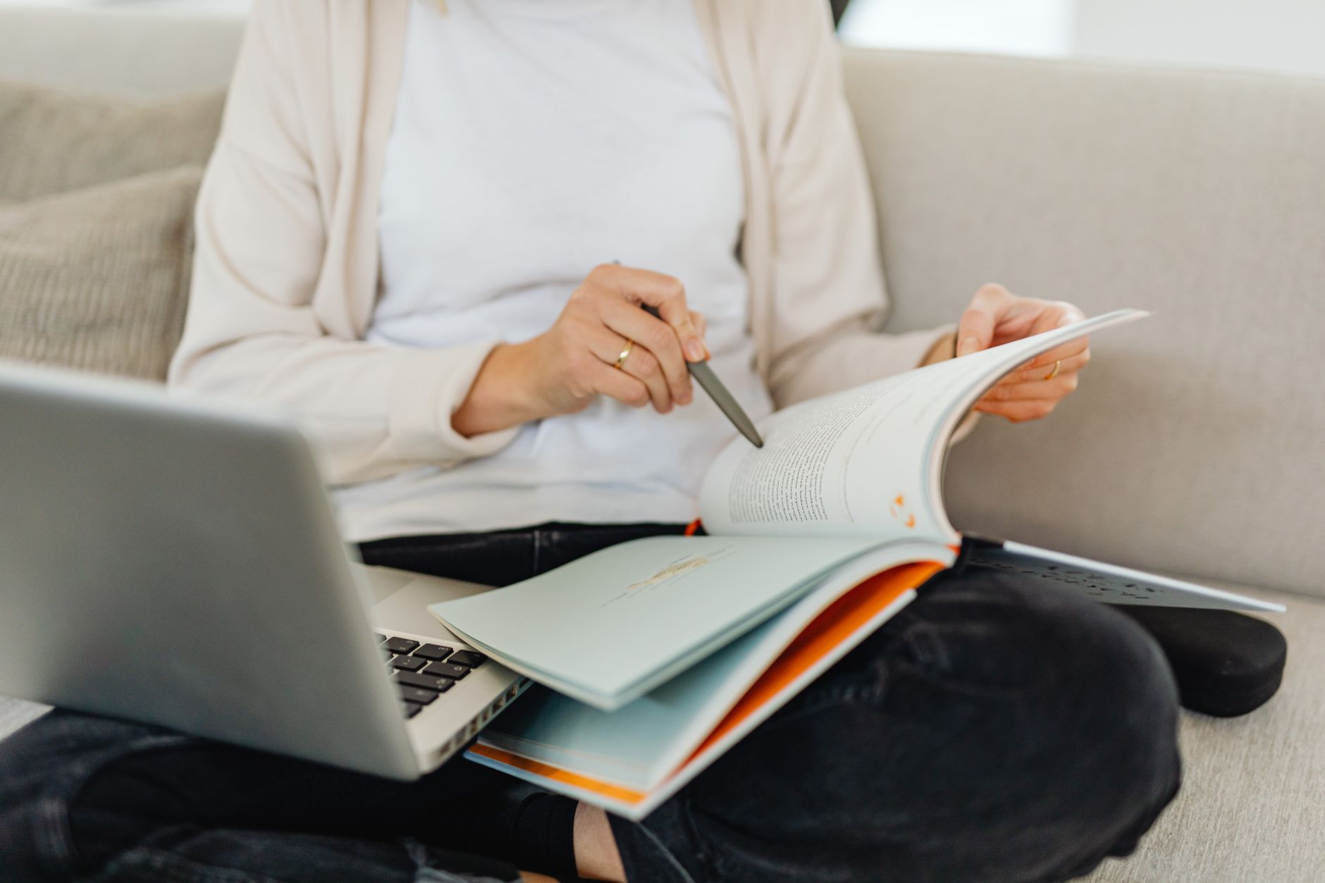 A photo of a person using a laptop with a debate notes document open. — online debating