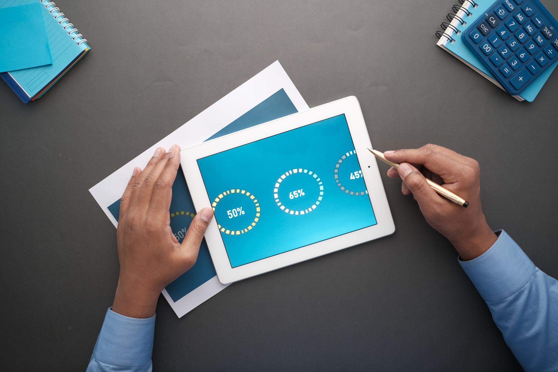 A photo of a person using a tablet to research debate topics. — technology in debating
