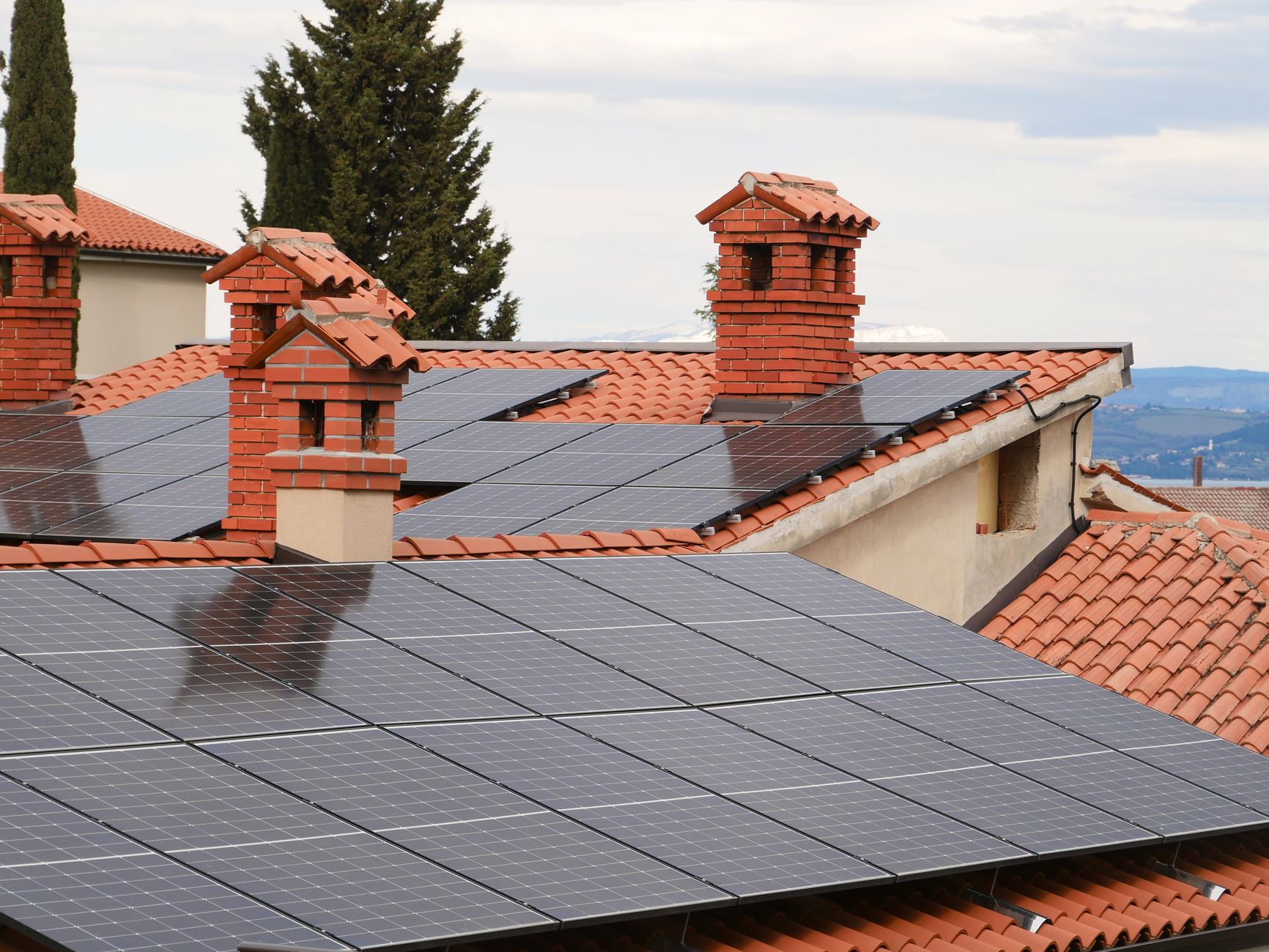 A photo of solar panels installed on a residential roof. — renewable energy debate