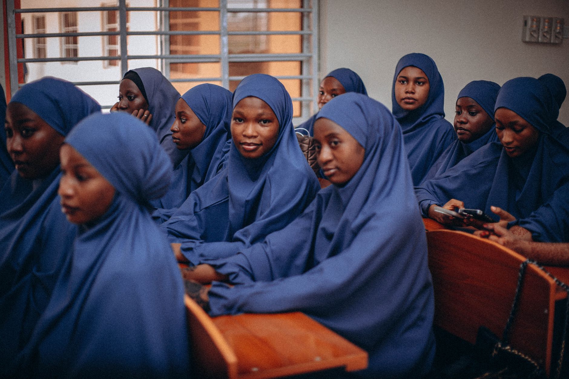 A photograph of a diverse classroom representing accessible education. — free education debate