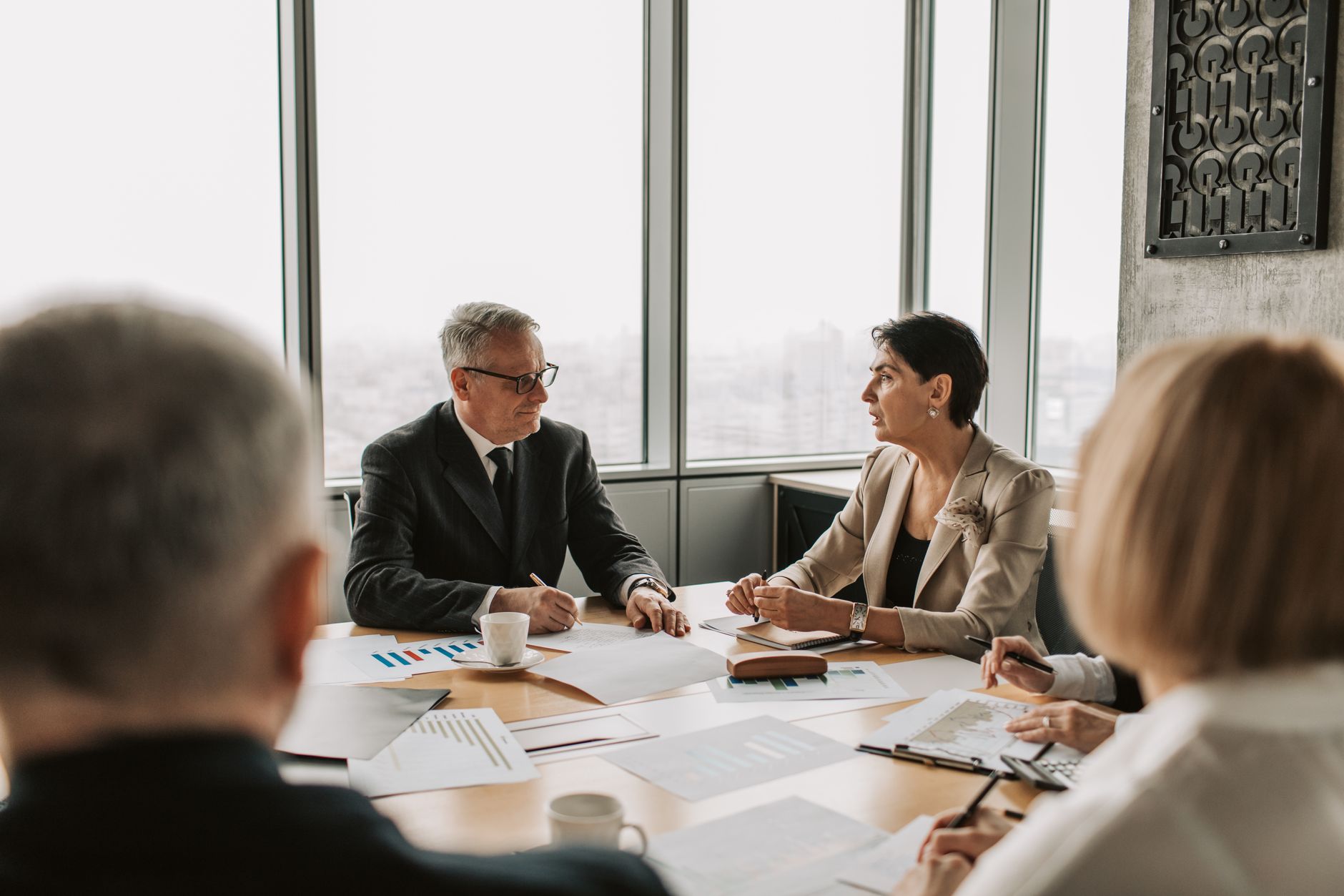 A professional discussing counterarguments in a meeting setting — handling counterarguments