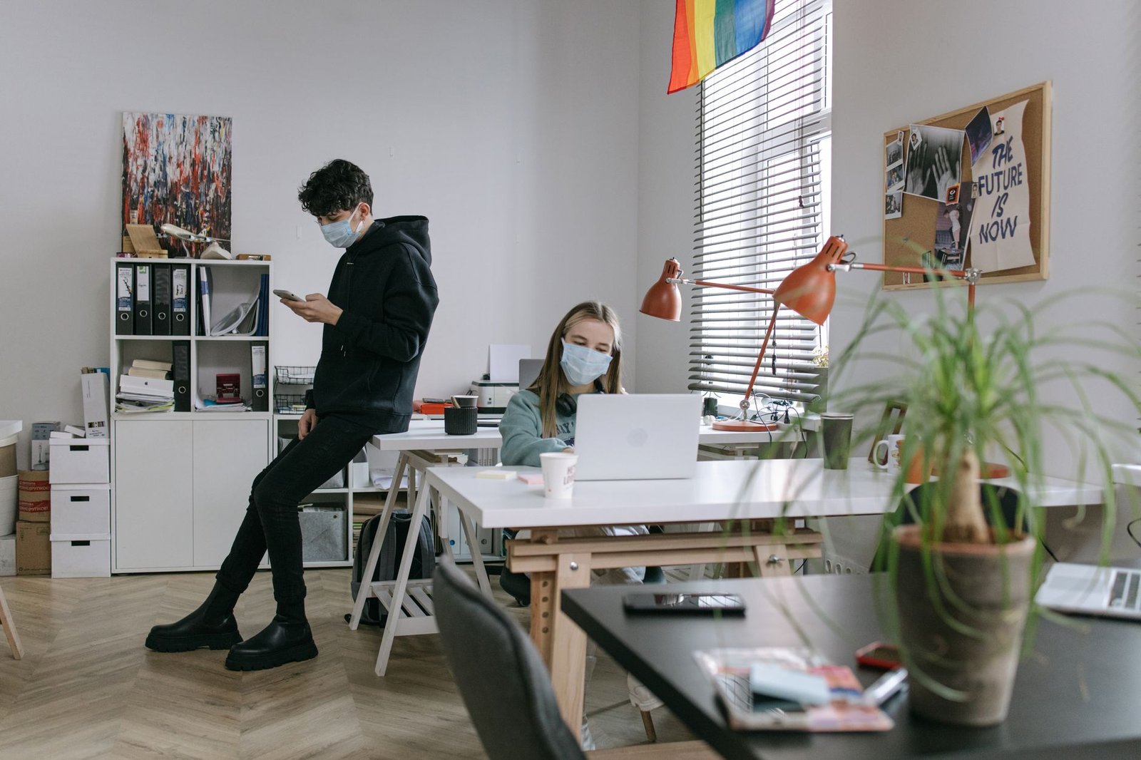 A split image comparing a remote work setup versus a traditional office environment, illustrating the future of work dynamics.