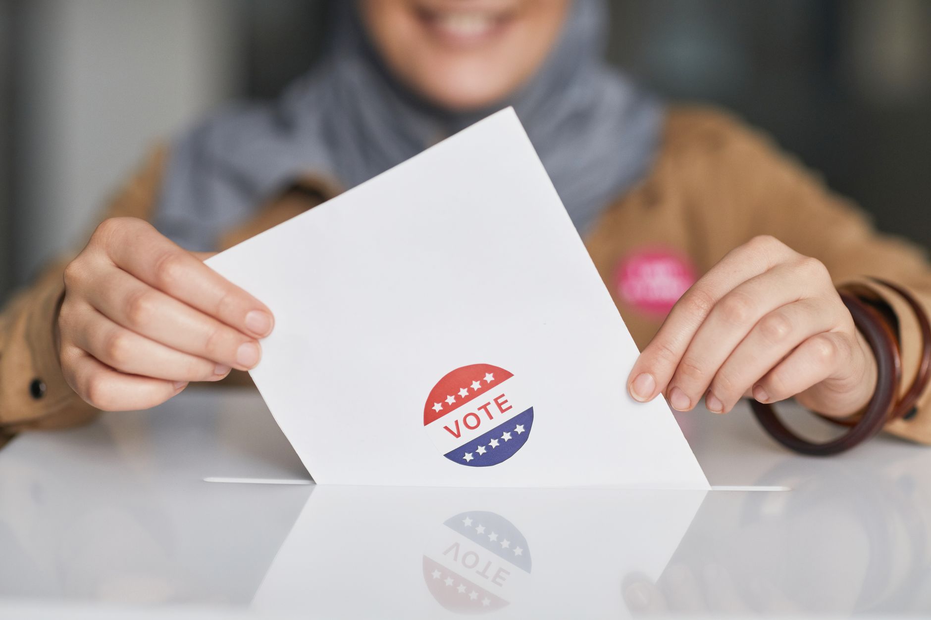 A young voter casting a ballot, symbolizing youth participation in elections. — voting age debate