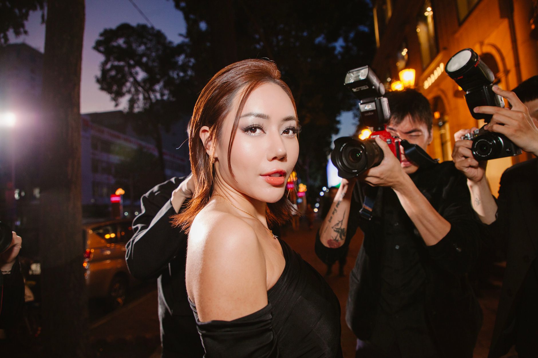 An image depicting a celebrity under media scrutiny, showing the stress of fame. — celebrity life debate