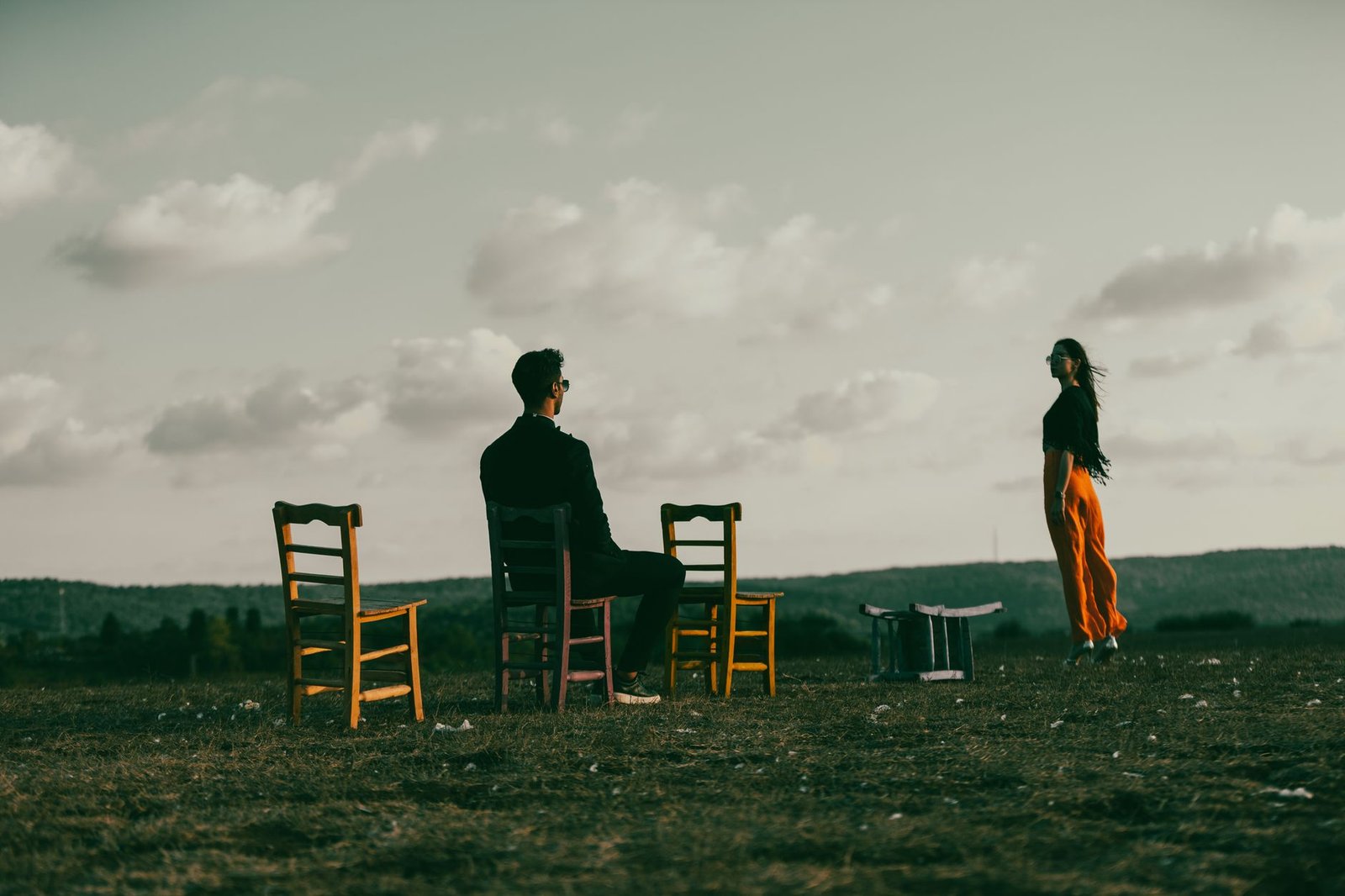 A calm outdoor setting where two individuals are debating, showing body language that conveys openness and respect. — re…