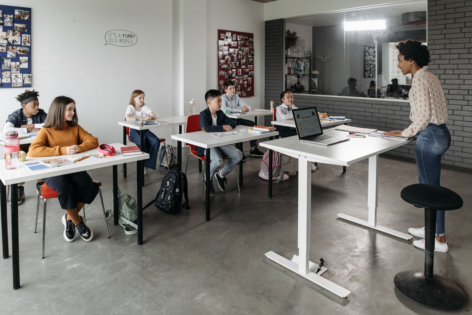 A classroom filled with diverse students engaging in learning, representing the accessibility of education. — free educa…