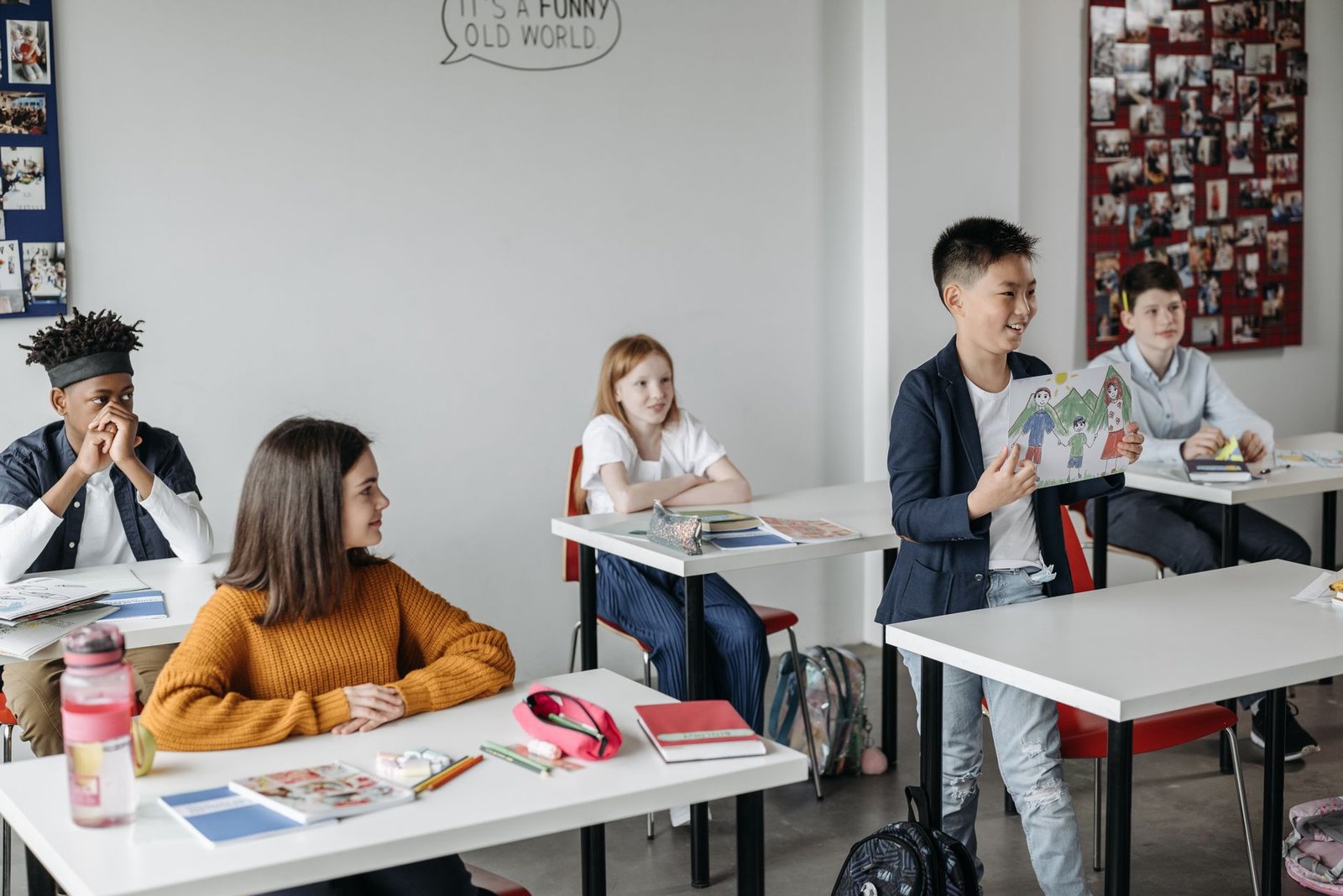A classroom setting where students are actively participating in a debate, illustrating a supportive and inclusive environ…
