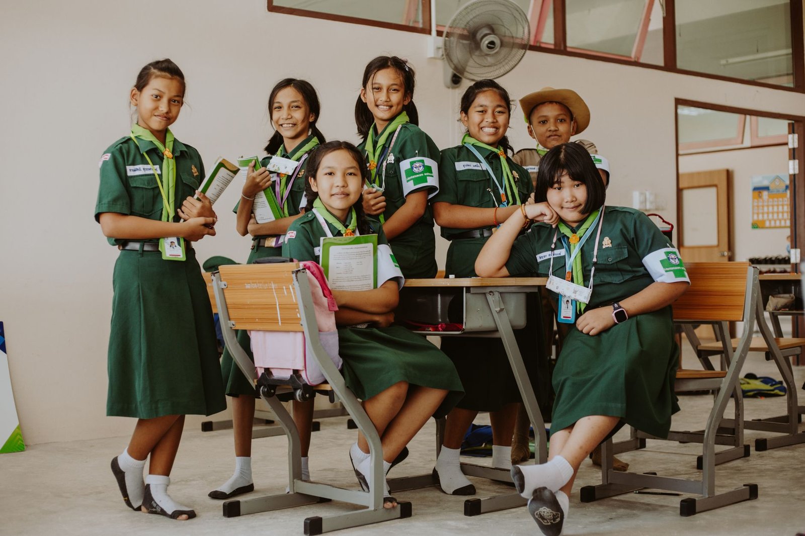 A classroom setting with students wearing uniforms, showcasing the diversity of the student body. — school uniforms debate