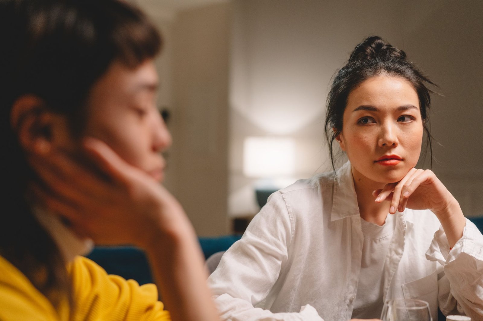 A close-up of a person actively listening during a conversation, emphasizing the importance of understanding differing per…