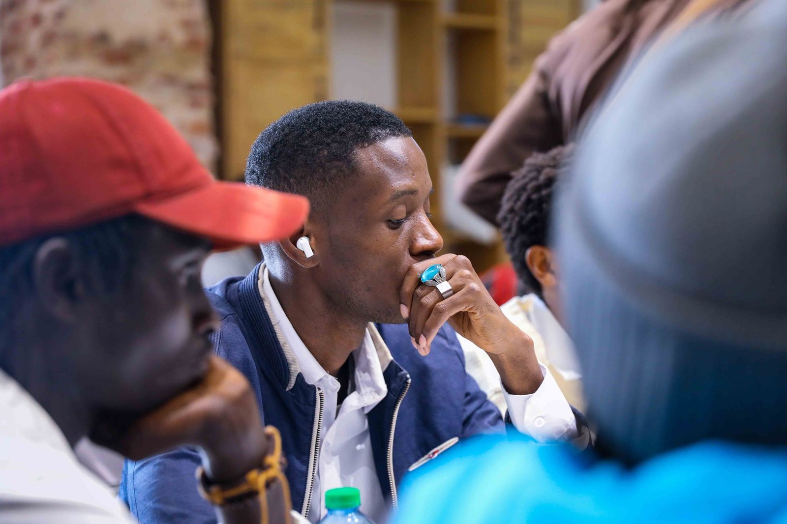A diverse group of people engaged in a discussion about environmental issues, showcasing respectful dialogue. — environm…