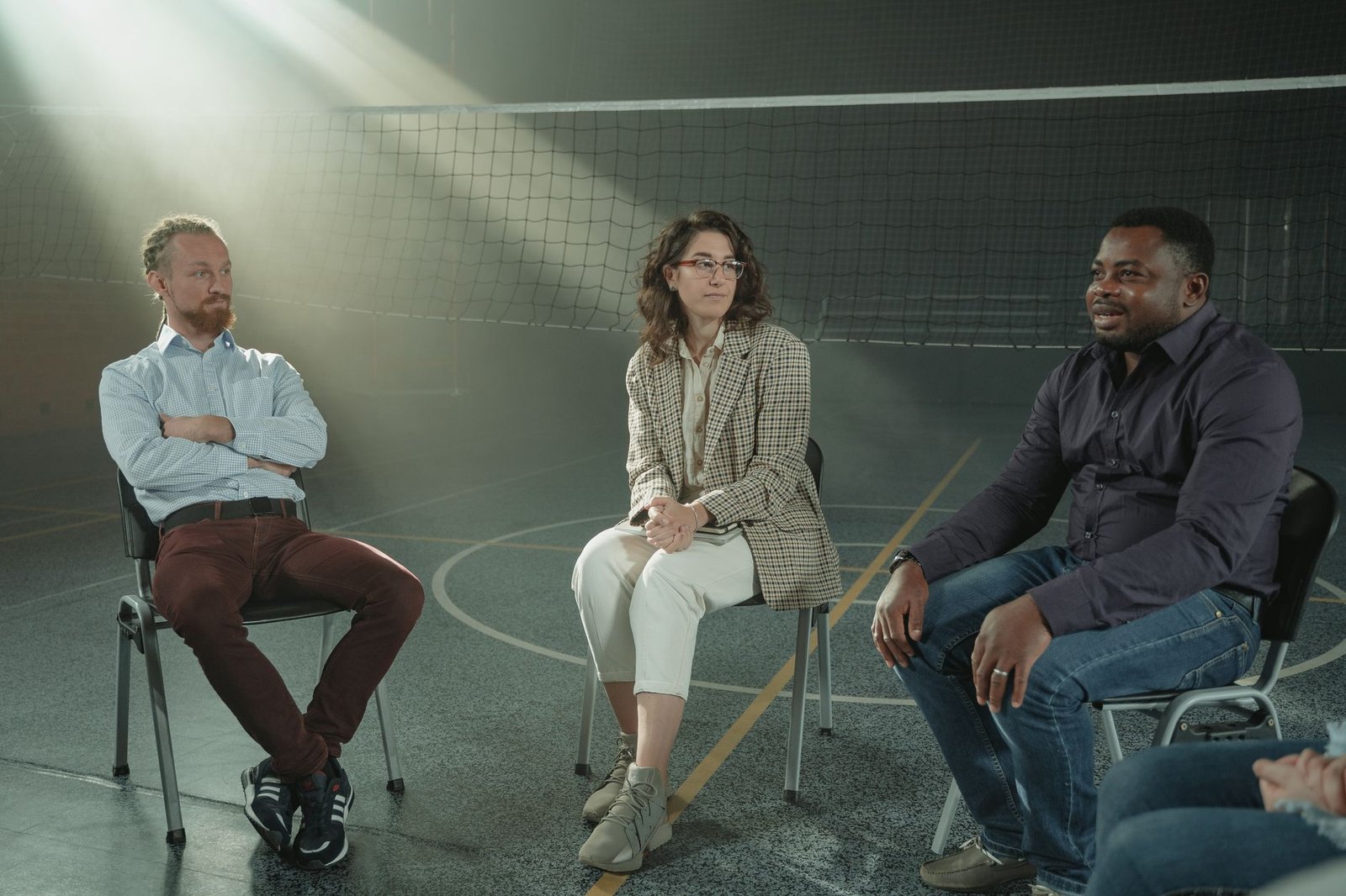 A diverse group of people engaged in a heated discussion about ethical issues, showcasing varying perspectives. — ethica…