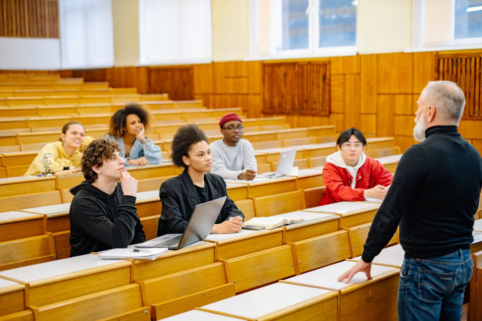 A group of college students engaged in a lively debate session. — debate topics
