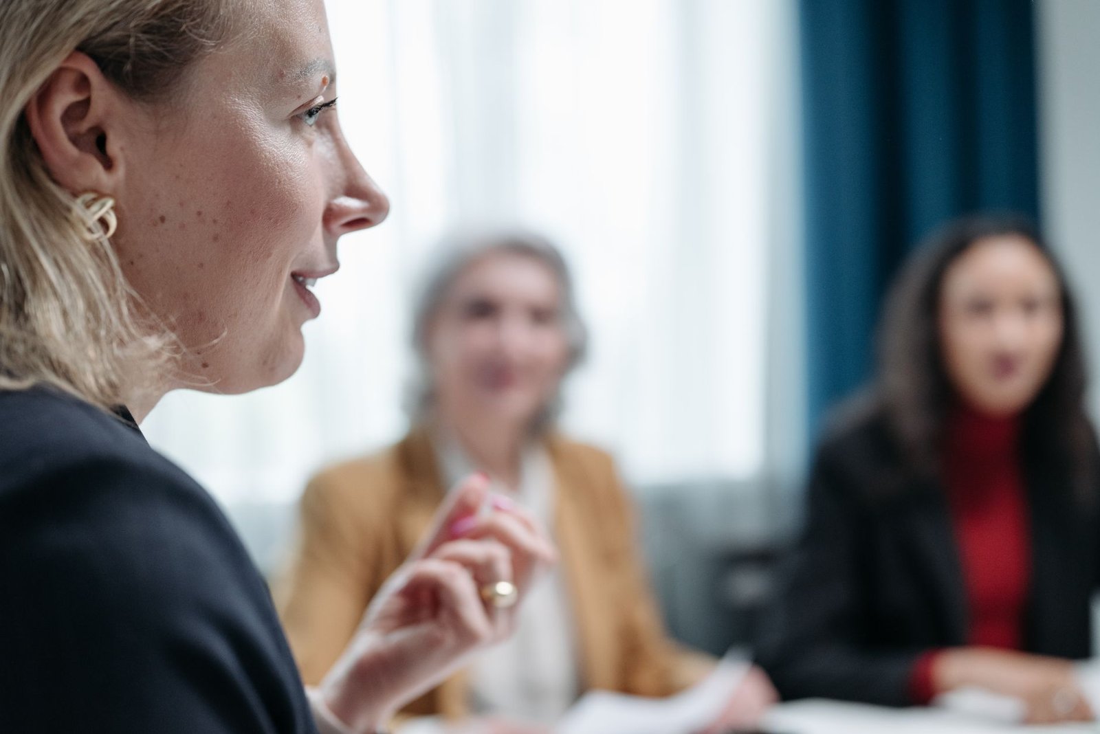 A group of diverse individuals engaged in a lively discussion, showcasing healthy debates.
