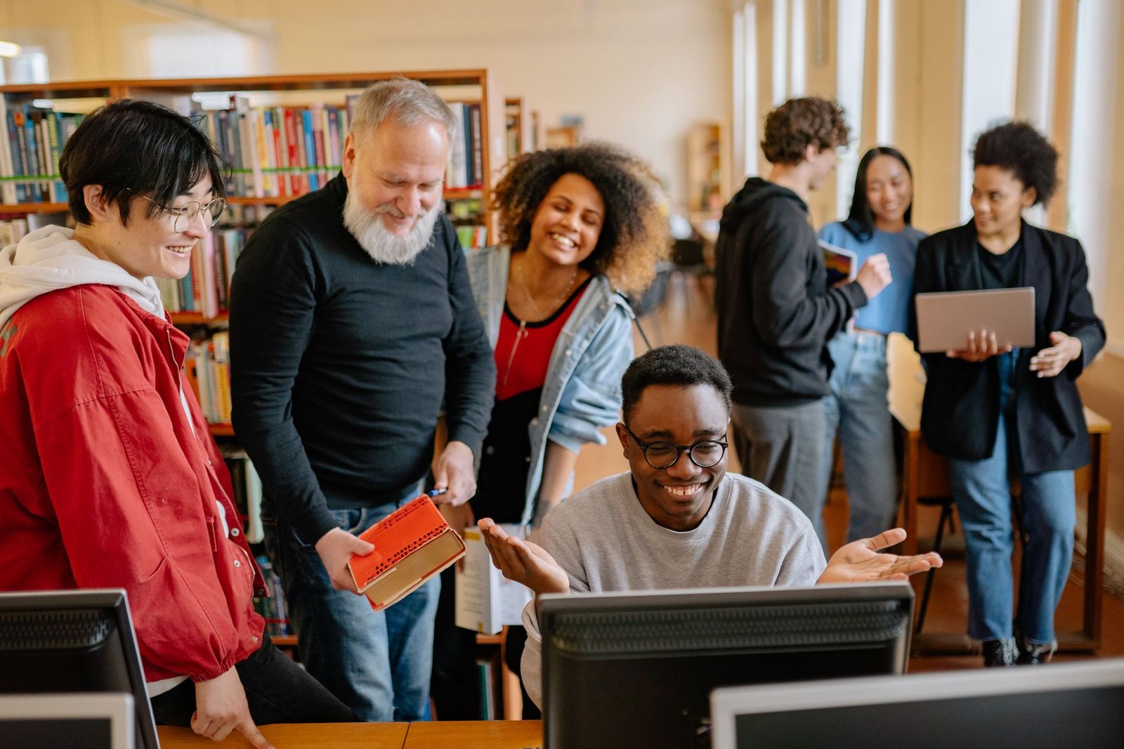 A group of diverse young students engaged in a lively debate session, showcasing enthusiasm and interaction. — youth deb…