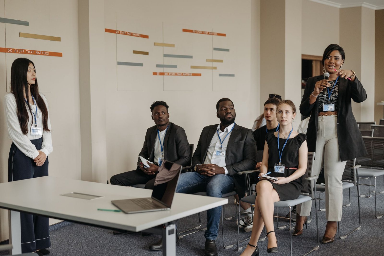 A group of professionals participating in a workshop focused on developing debate skills for professionals.