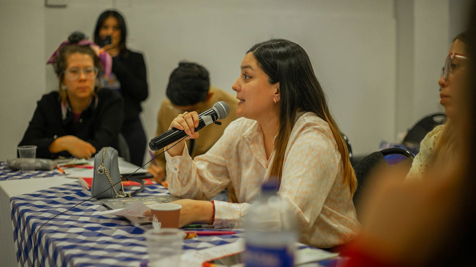 A group of students engaged in a debate, showcasing teamwork and communication. — debate club benefits