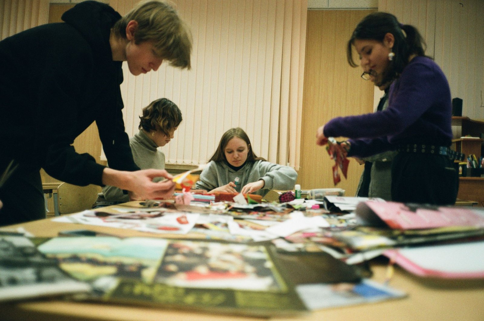 A group of young debaters preparing for their arguments, illustrating teamwork. — youth in debates