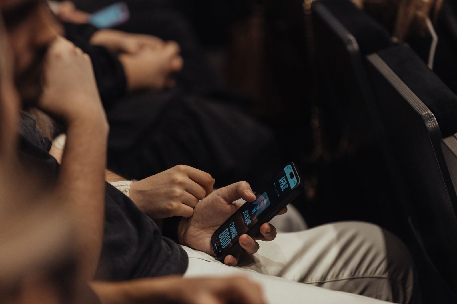 A photo of a candidate participating in a digital debate with a visible audience on social media. — digital political de…