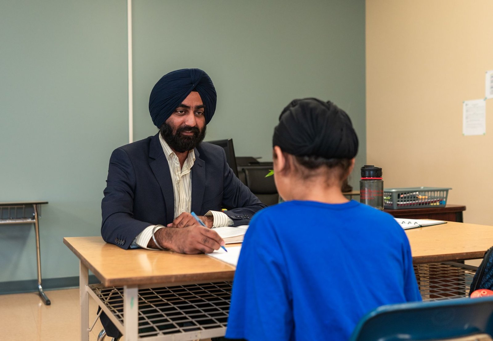 A photo of a parent-teacher meeting discussing student well-being. — student stress debate