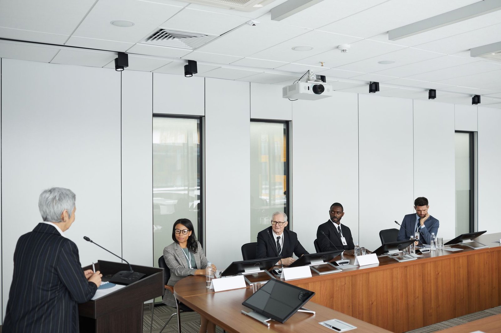 A screenshot of a virtual debate setup, showcasing participants using technology in debating.
