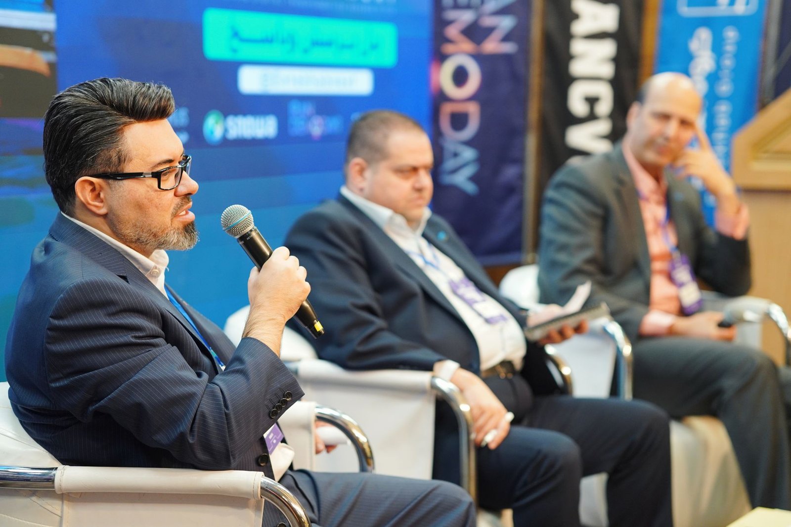 A snapshot of a Public Forum debate setup, showcasing the stage and audience interaction. — debate formats