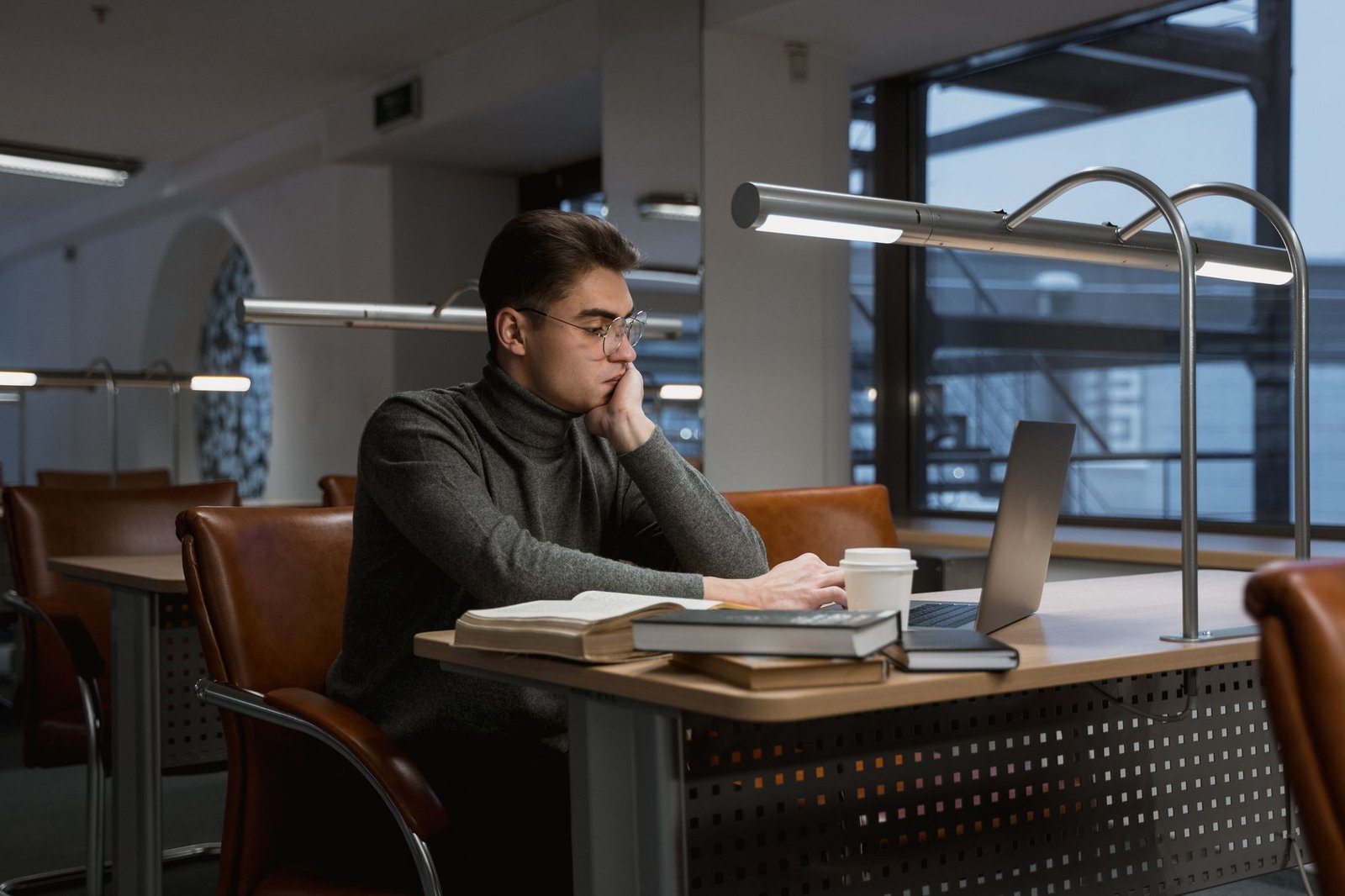A student researching debate topics in a library or online. — debate preparation