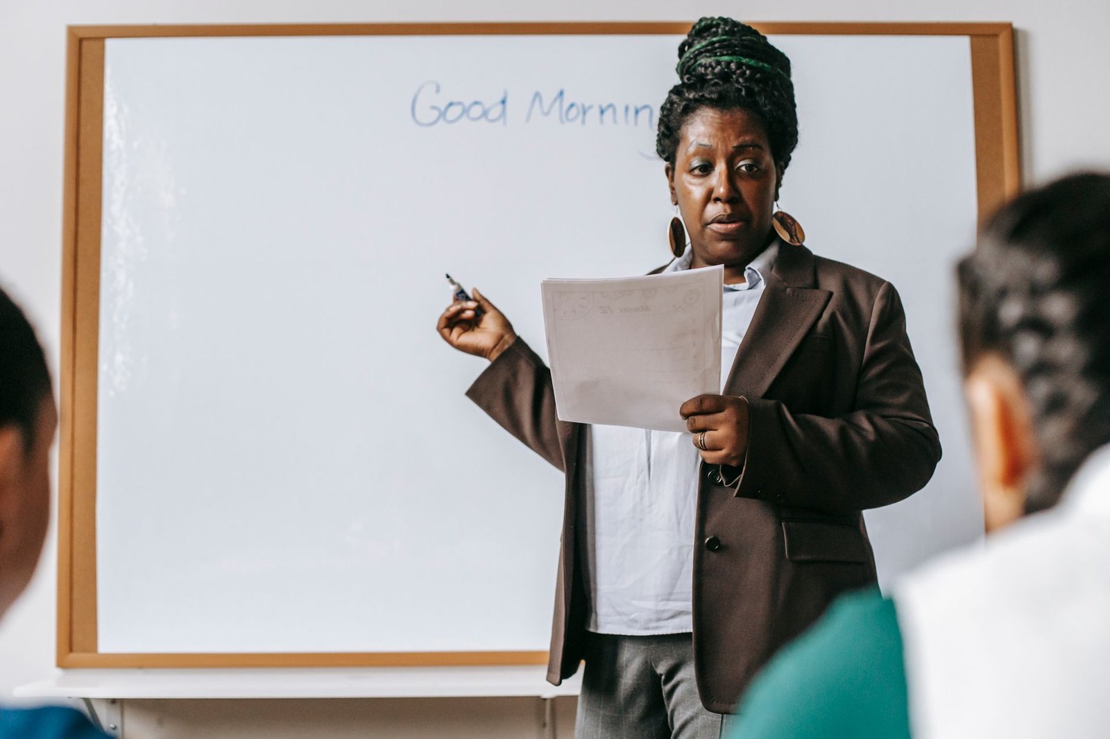 A teacher facilitating a debate session, highlighting effective moderation techniques. — debates in education