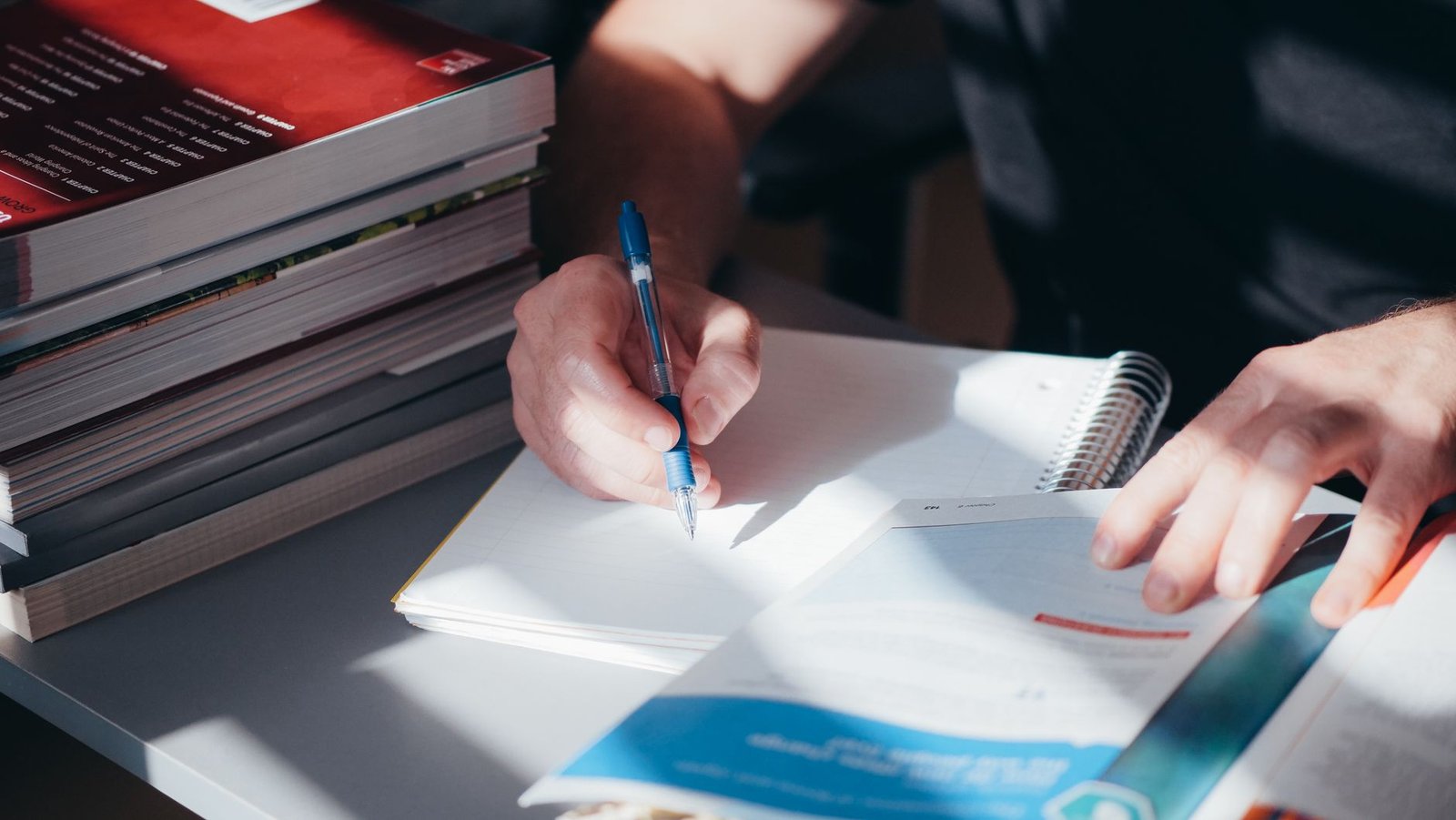 A well-organized desk with debate notes and books open, showcasing the preparation process. — debate preparation tips