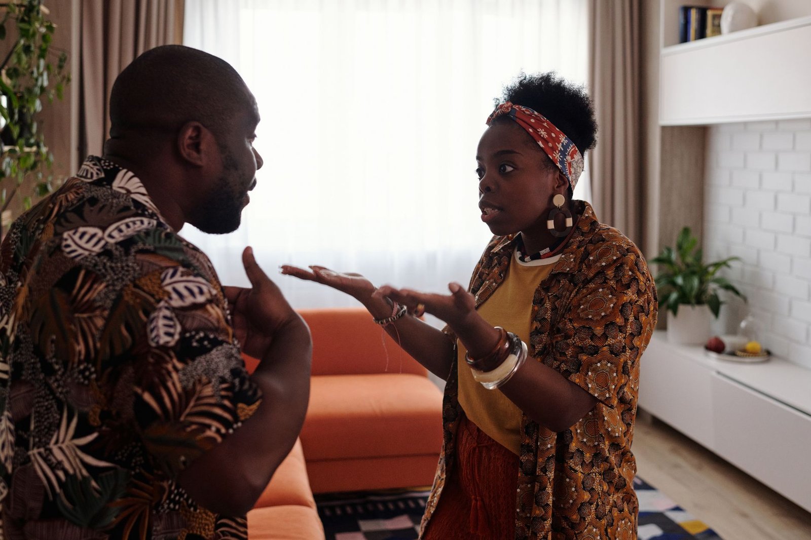 An illustration showing a heated argument between two people in a casual setting. — debate vs argument
