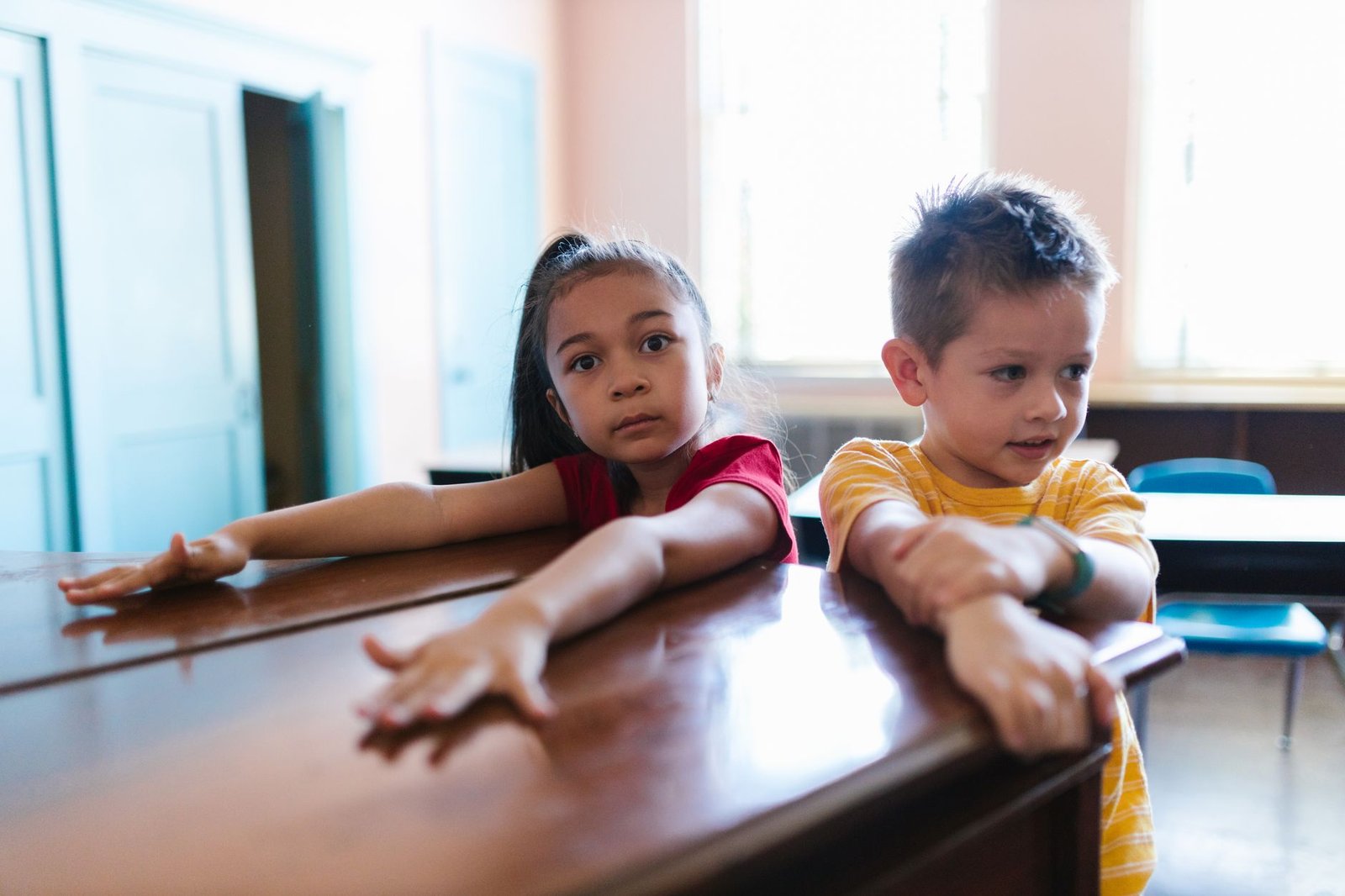 An image of students engaging in mindfulness activities in a classroom setting. — student stress debate