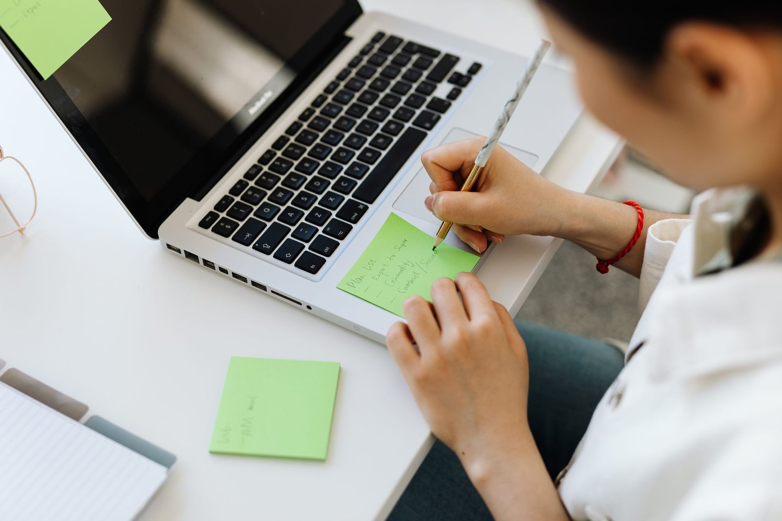 An introvert practicing debate strategies for introverts in a quiet environment with notes and a laptop.