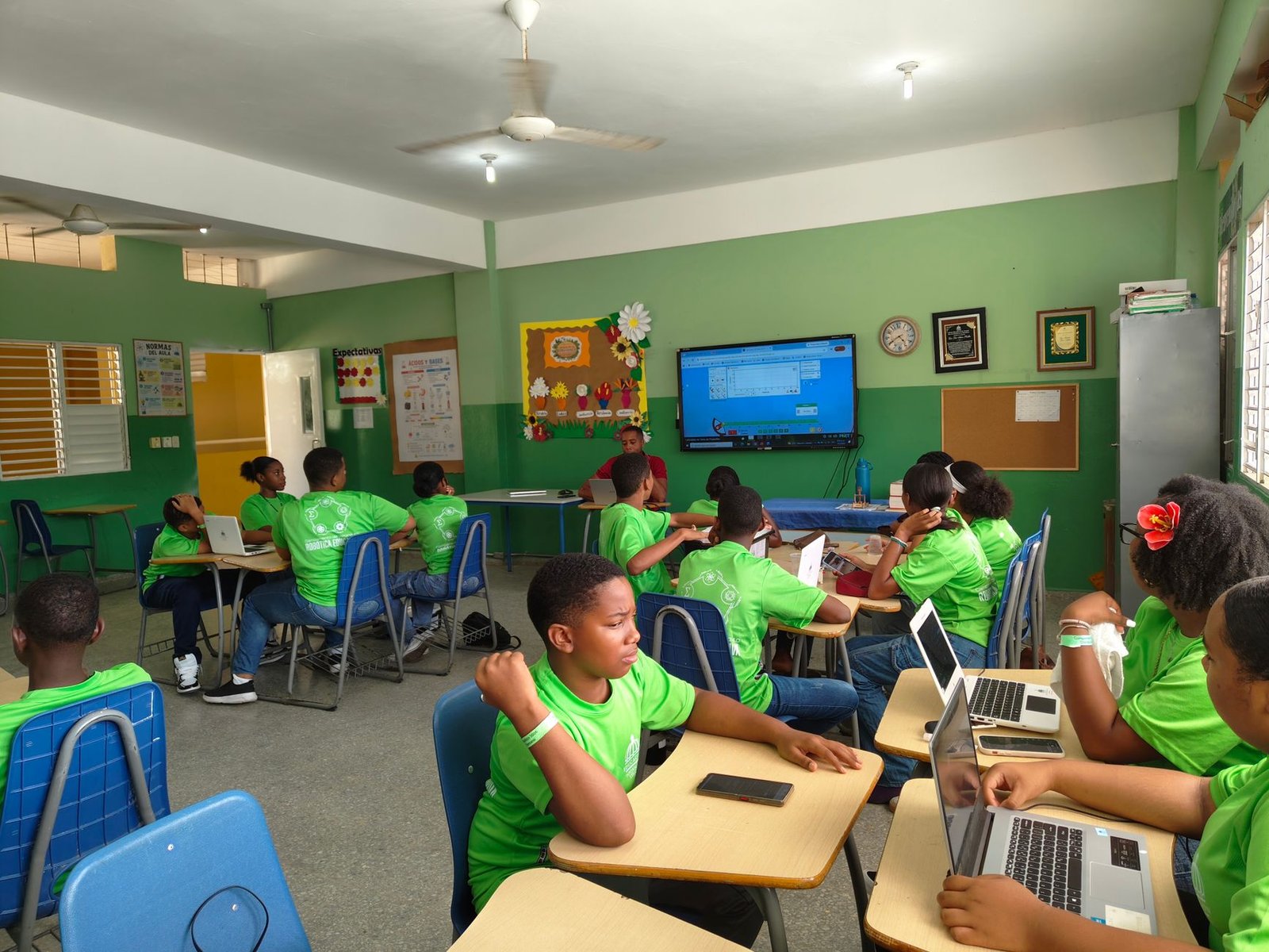 Students engaging with AI tools in a classroom setting. — AI education debate