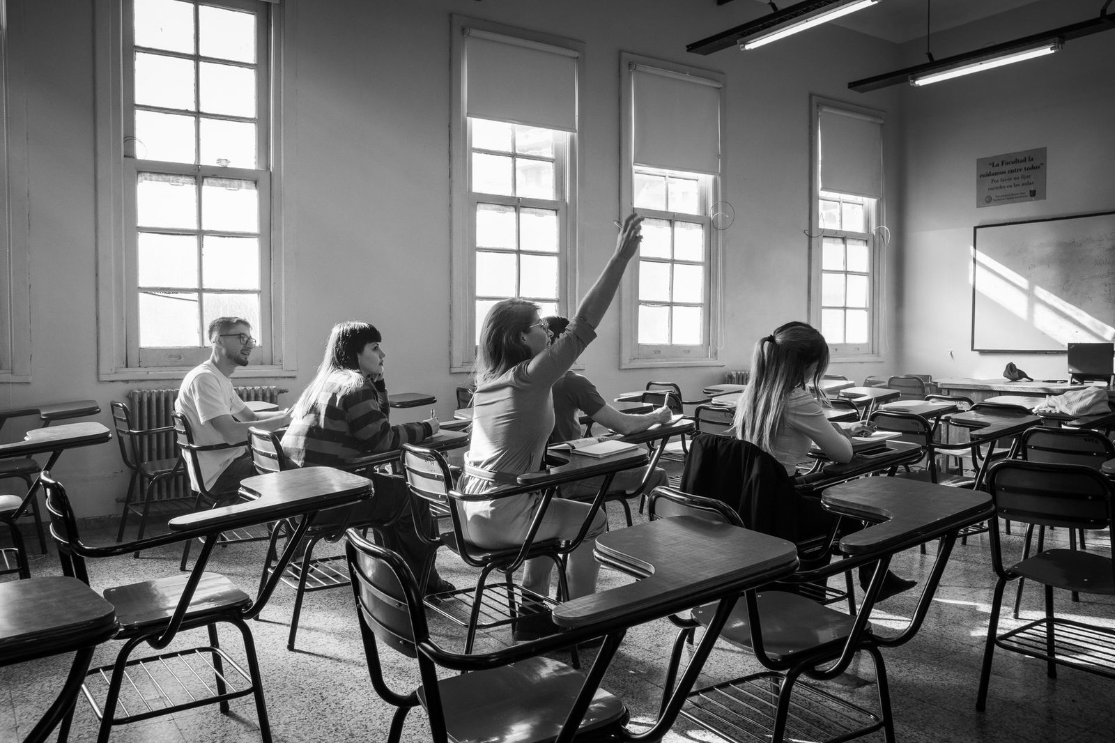 A classroom setting where students are engaged in a media literacy discussion about education misinformation.