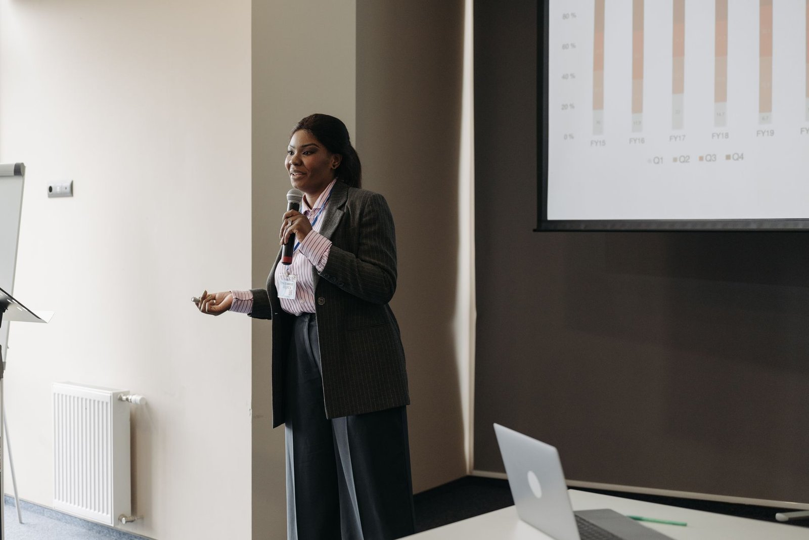 A close-up of a business professional making a persuasive argument with visual aids. — business debating skills