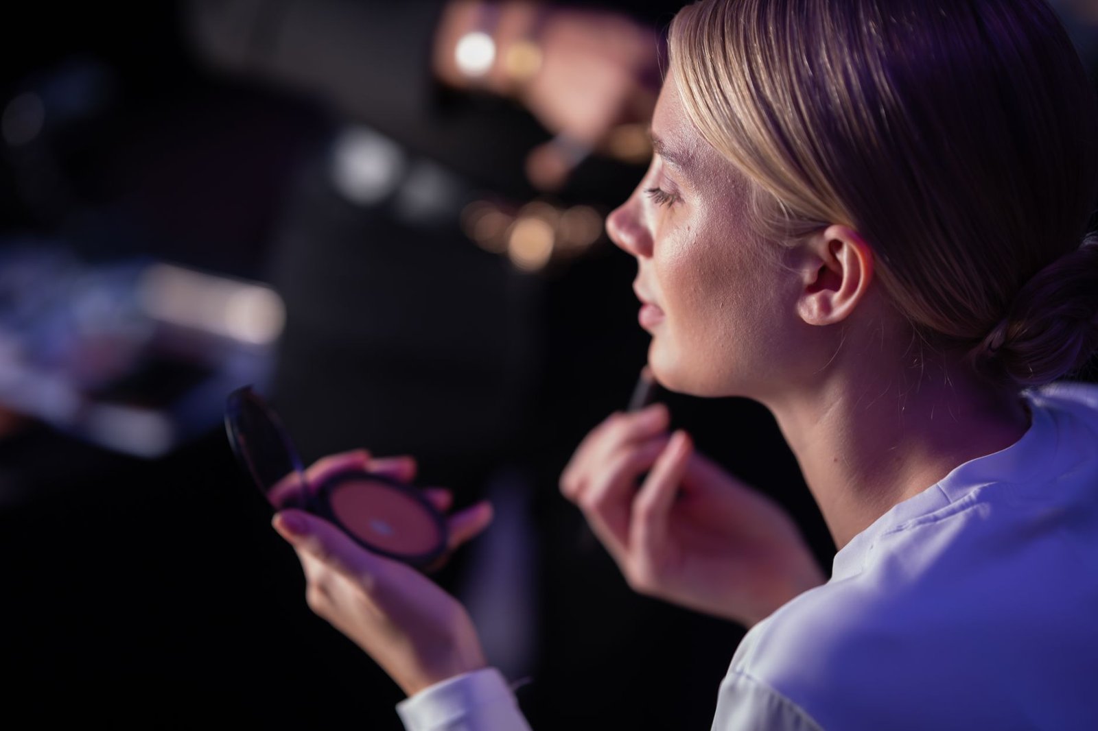 A close-up of a person practicing their speech in front of a mirror, showcasing confidence-building techniques. — debate…