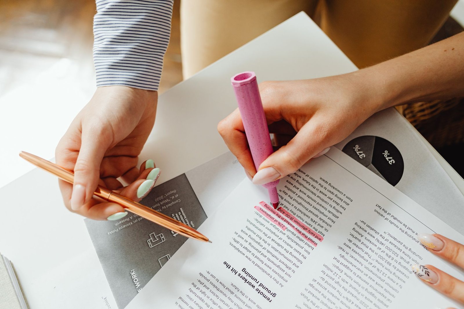 A close-up of a research document with highlighted notes and key points for debate preparation.